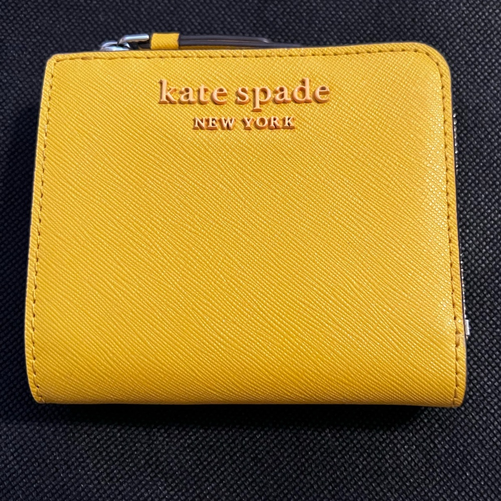 Kate spade yellow/goldish staci zip around wallet. Gently used great condition